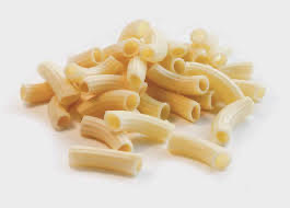 Close-up of fresh rigatoni showing the bronze-die surface and ridges.